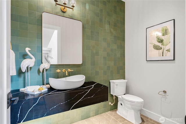 12811 SE 44th Pl, Bellevue, WA 98006 - half bathroom with tile walls, vanity, toilet, tile patterned flooring, and baseboards