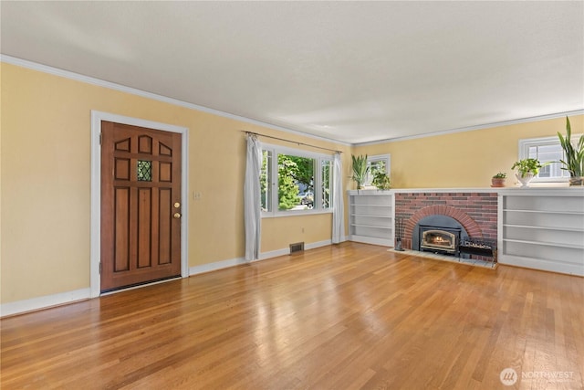 912 Highland Dr, Wenatchee, WA 98801 - unfurnished living room featuring light wood finished floors, ornamental molding, and baseboards