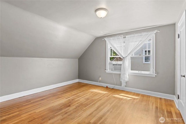 912 Highland Dr, Wenatchee, WA 98801 - bonus room featuring light wood-type flooring, baseboards, lofted ceiling, and cooling unit