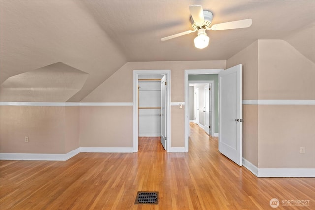 912 Highland Dr, Wenatchee, WA 98801 - bonus room featuring vaulted ceiling, a ceiling fan, light wood-style flooring, and baseboards
