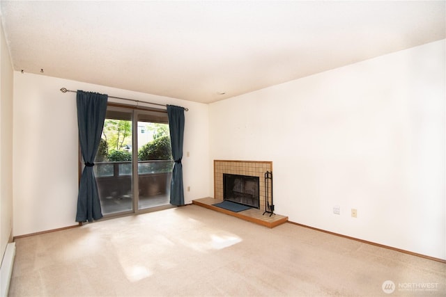 3421 SW Roxbury St Unit 106, Seattle, WA 98126 - unfurnished living room featuring carpet floors, a fireplace, baseboard heating, and baseboards