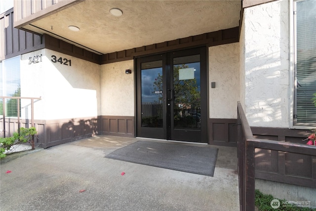 3421 SW Roxbury St Unit 106, Seattle, WA 98126 - entrance to property featuring stucco siding, french doors, and a patio