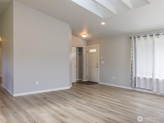 41 Kates Ct, Port Angeles, WA 98362 - spare room with a skylight, recessed lighting, light wood-style flooring, and baseboards