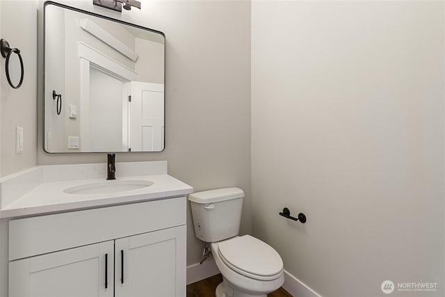 5942LOT47 Ranch Loop, Ferndale, WA 98248 - half bath with vanity, toilet, baseboards, and wood finished floors