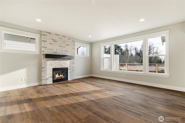5942LOT47 Ranch Loop, Ferndale, WA 98248 - unfurnished living room featuring wood finished floors, baseboards, a fireplace, and recessed lighting
