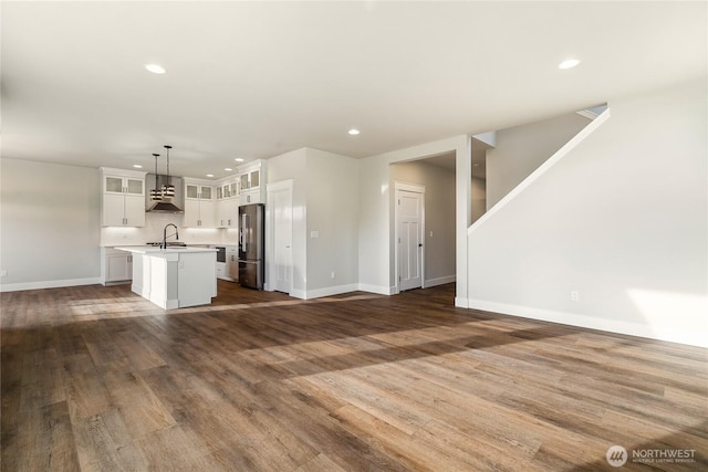 5942LOT47 Ranch Loop, Ferndale, WA 98248 - unfurnished living room with baseboards, dark wood-style floors, recessed lighting, and a sink