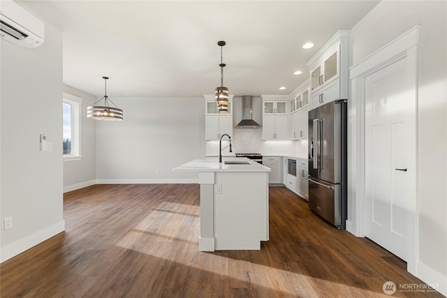 5942LOT47 Ranch Loop, Ferndale, WA 98248 - kitchen with high end fridge, wall chimney exhaust hood, a wall mounted air conditioner, tasteful backsplash, and recessed lighting