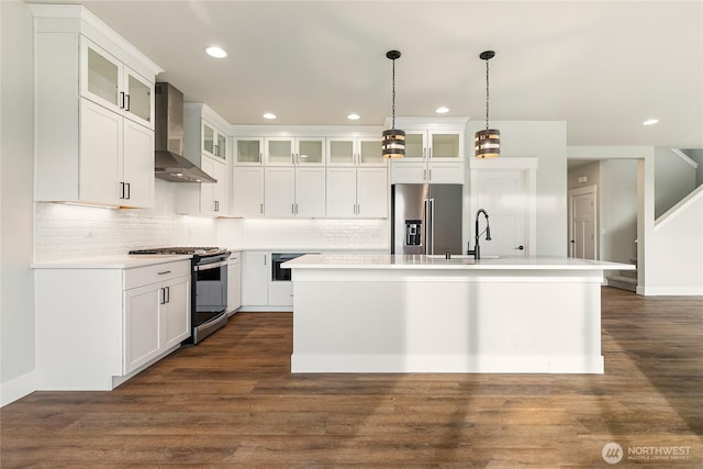 5942LOT47 Ranch Loop, Ferndale, WA 98248 - kitchen with appliances with stainless steel finishes, wall chimney exhaust hood, recessed lighting, a sink, and a center island with sink