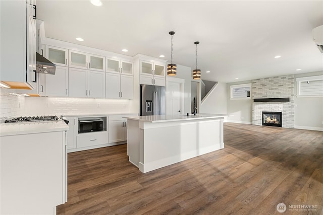 5942LOT47 Ranch Loop, Ferndale, WA 98248 - kitchen with high quality fridge, black microwave, dark wood-type flooring, light countertops, and recessed lighting