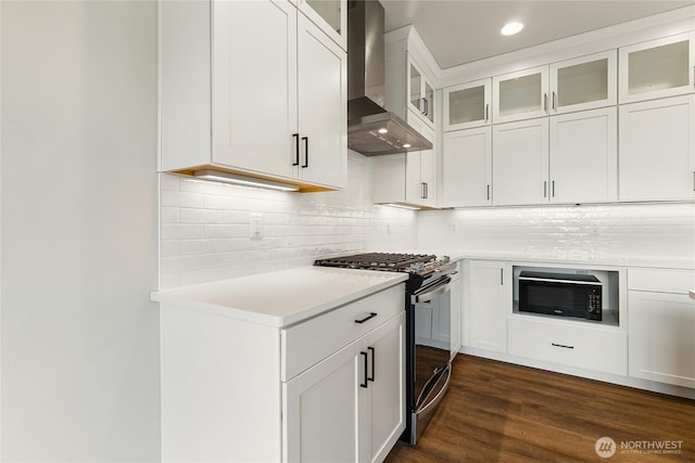 5942LOT47 Ranch Loop, Ferndale, WA 98248 - kitchen with wall chimney range hood, stainless steel gas range, light countertops, black microwave, and dark wood-style floors