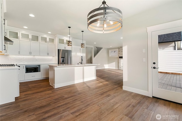 5942LOT47 Ranch Loop, Ferndale, WA 98248 - kitchen featuring high end refrigerator, ventilation hood, dark wood-style floors, light countertops, and white cabinets