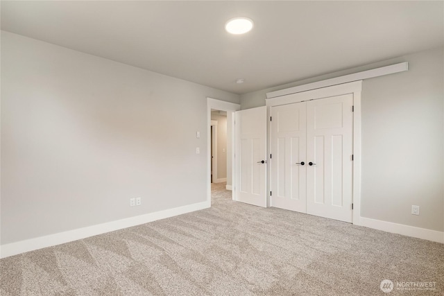 5942LOT47 Ranch Loop, Ferndale, WA 98248 - unfurnished bedroom featuring carpet flooring, baseboards, and a closet