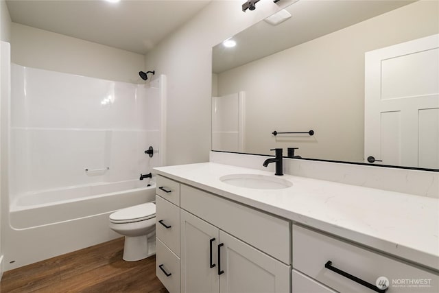 5942LOT47 Ranch Loop, Ferndale, WA 98248 - bathroom featuring vanity, wood finished floors, toilet,  shower combination, and recessed lighting