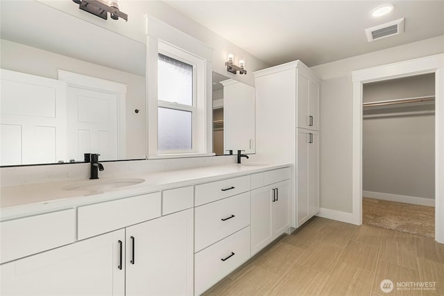 5942LOT47 Ranch Loop, Ferndale, WA 98248 - full bathroom with double vanity, a spacious closet, and baseboards