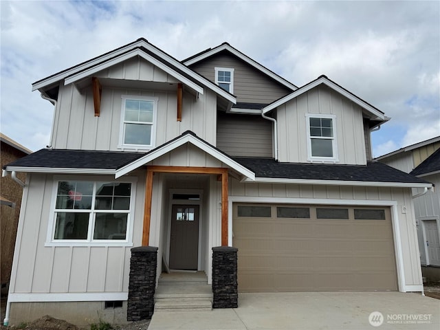 5942LOT47 Ranch Loop, Ferndale, WA 98248 - view of front facade with an attached garage, driveway, roof with shingles, and board and batten siding