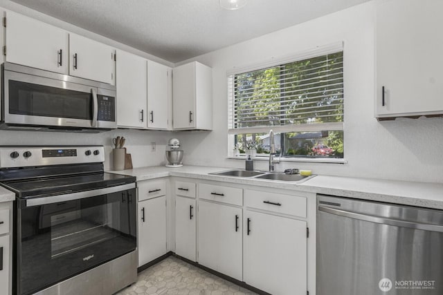 2209 Mciver Ct SW, Tumwater, WA 98512 - kitchen with appliances with stainless steel finishes, a sink, and light countertops