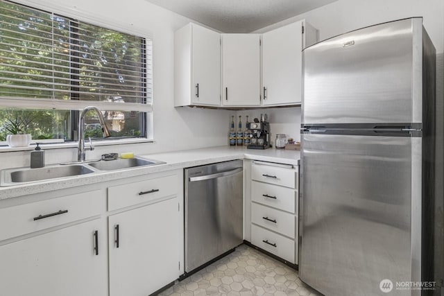 2209 Mciver Ct SW, Tumwater, WA 98512 - kitchen with stainless steel appliances, a sink, healthy amount of natural light, and light countertops