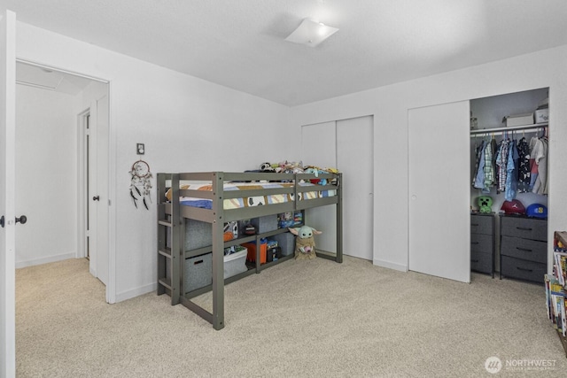 2209 Mciver Ct SW, Tumwater, WA 98512 - bedroom featuring two closets and carpet flooring