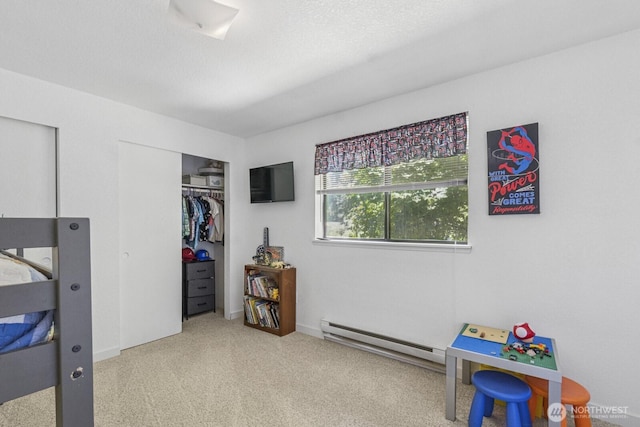 2209 Mciver Ct SW, Tumwater, WA 98512 - carpeted bedroom featuring a baseboard heating unit and a closet