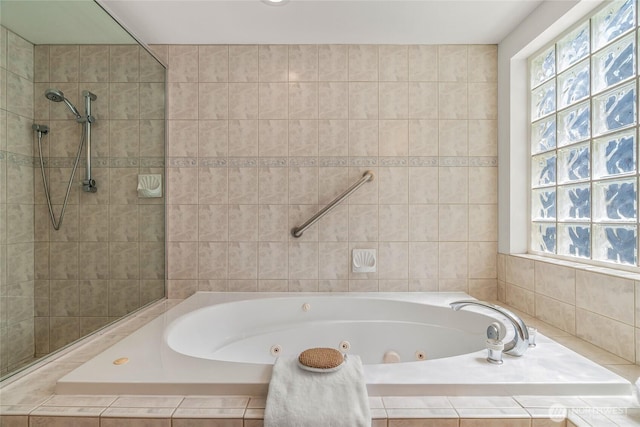 2627 Warren Ave N Unit 200, Seattle, WA 98109 - bathroom featuring a jetted tub and a tile shower