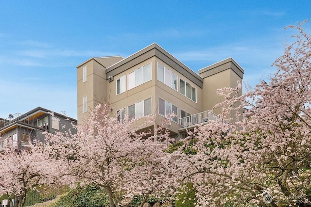 2627 Warren Ave N Unit 200, Seattle, WA 98109 - view of home's exterior featuring stucco siding