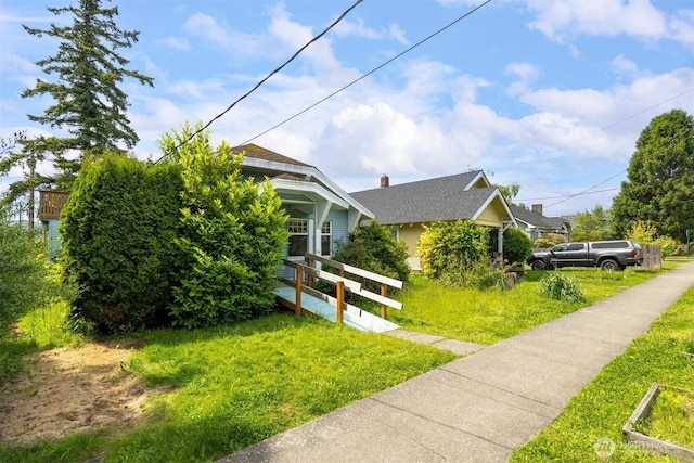 208 Carolina St, Bellingham, WA 98225 - view of home's exterior with a yard