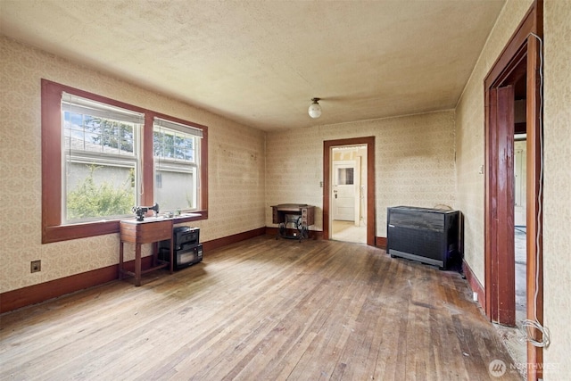 208 Carolina St, Bellingham, WA 98225 - interior space featuring hardwood / wood-style flooring, baseboards, and heating unit