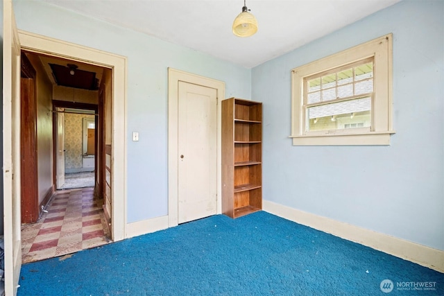 208 Carolina St, Bellingham, WA 98225 - unfurnished bedroom featuring a closet, baseboards, and tile patterned floors