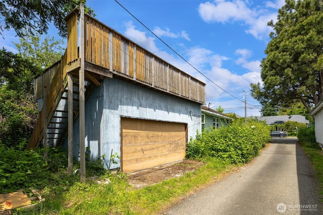 208 Carolina St, Bellingham, WA 98225 - view of home's exterior featuring stairway and driveway