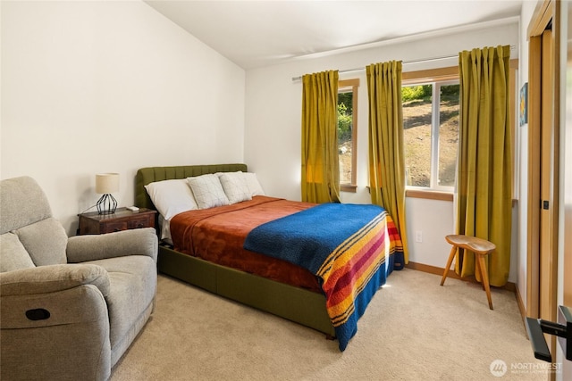 720 Stone Ridge Dr, Cle Elum, WA 98922 - bedroom featuring light carpet and vaulted ceiling