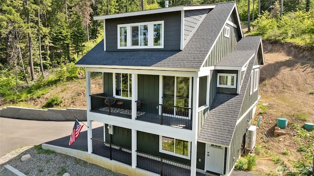 720 Stone Ridge Dr, Cle Elum, WA 98922 - view of front facade with a patio area, board and batten siding, and a shingled roof