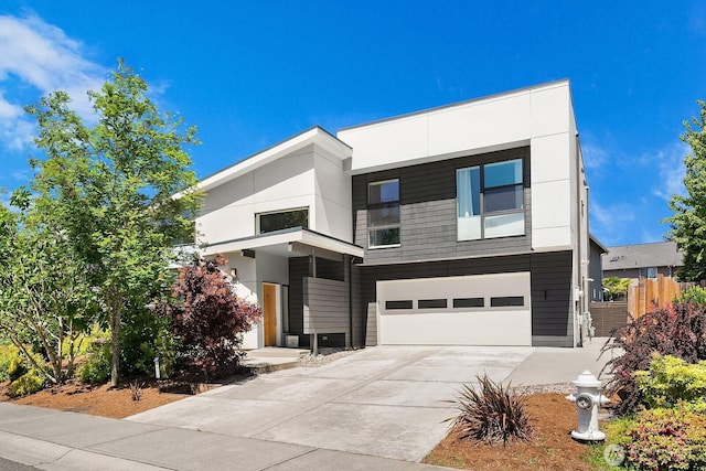 8622 NE 177th Pl, Bothell, WA 98011 - contemporary home with concrete driveway and a garage