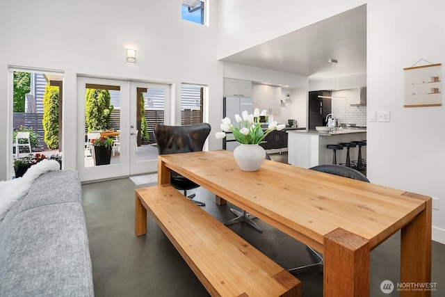 8622 NE 177th Pl, Bothell, WA 98011 - dining room featuring concrete flooring, french doors, and a high ceiling