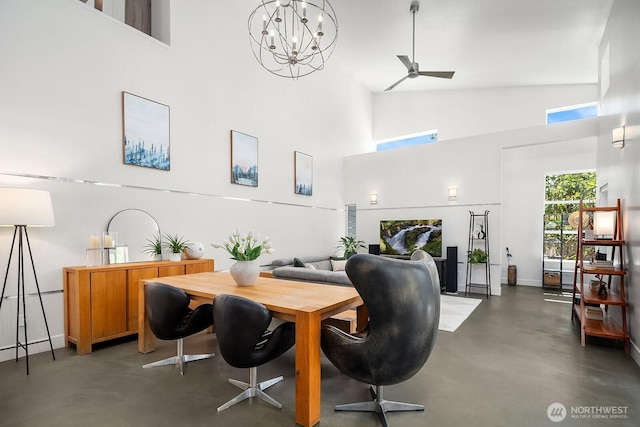 8622 NE 177th Pl, Bothell, WA 98011 - dining area featuring a towering ceiling, concrete flooring, a ceiling fan, a chandelier, and baseboards