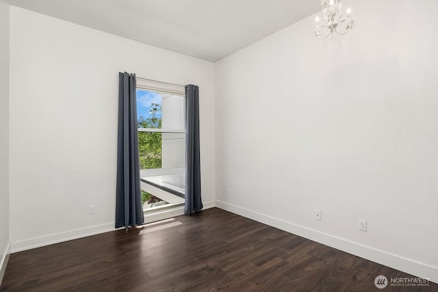 8622 NE 177th Pl, Bothell, WA 98011 - unfurnished room featuring dark wood finished floors, baseboards, and a chandelier