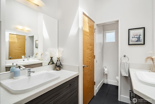 8622 NE 177th Pl, Bothell, WA 98011 - full bath with tile patterned floors, vanity, toilet, and baseboards
