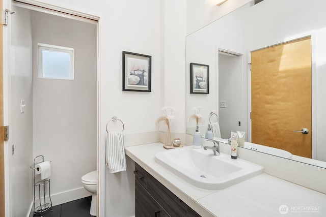 8622 NE 177th Pl, Bothell, WA 98011 - bathroom with toilet, vanity, and baseboards