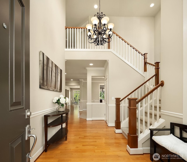 27528 SE 28th Ct, Sammamish, WA 98075 - foyer entrance featuring wood finished floors, stairs, recessed lighting, a chandelier, and baseboards