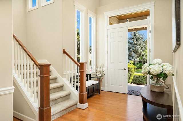 27528 SE 28th Ct, Sammamish, WA 98075 - entrance foyer with light wood-type flooring, stairs, and baseboards