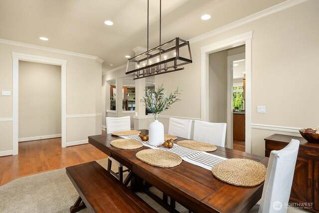 27528 SE 28th Ct, Sammamish, WA 98075 - dining room featuring ornamental molding, recessed lighting, wood finished floors, and a chandelier