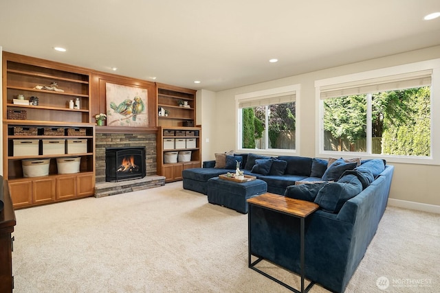 27528 SE 28th Ct, Sammamish, WA 98075 - living area with light carpet, recessed lighting, a stone fireplace, and baseboards