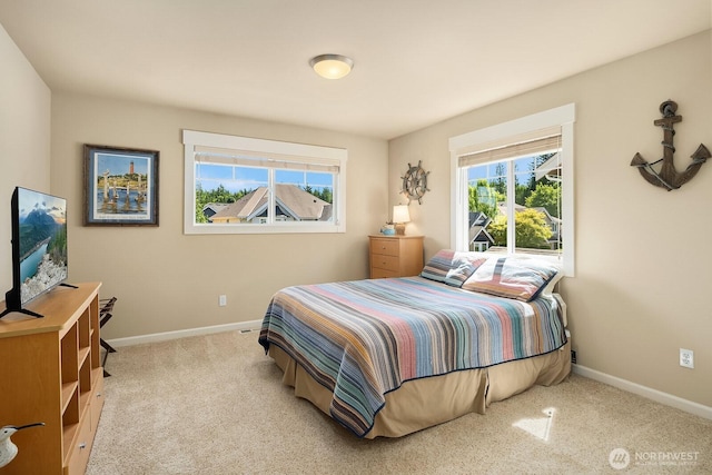 27528 SE 28th Ct, Sammamish, WA 98075 - bedroom featuring multiple windows, baseboards, and carpet