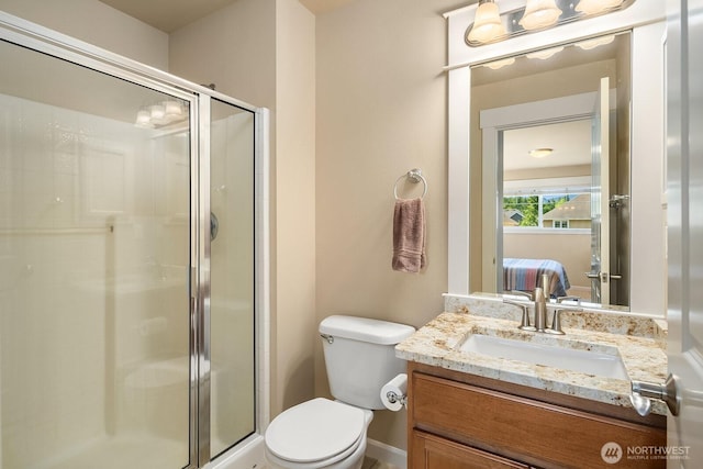 27528 SE 28th Ct, Sammamish, WA 98075 - bathroom with vanity, a shower stall, toilet, ensuite bathroom, and baseboards