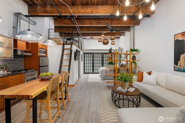 1505 11th Ave Unit 310, Seattle, WA 98122 - living room with light wood-style floors and wood ceiling