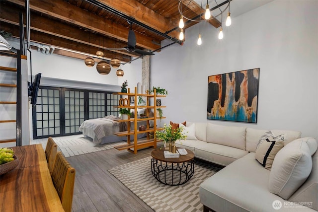 1505 11th Ave Unit 310, Seattle, WA 98122 - living room with wood ceiling with exposed beams, wood finished floors, and a chandelier