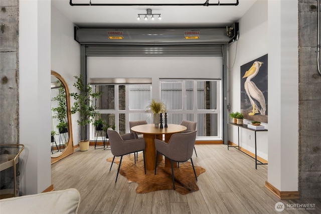 1505 11th Ave Unit 310, Seattle, WA 98122 - dining room with wood finished floors and baseboards