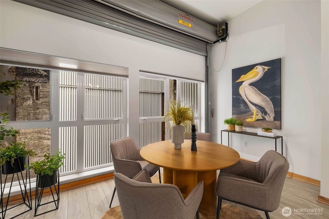 1505 11th Ave Unit 310, Seattle, WA 98122 - dining space featuring wood finished floors