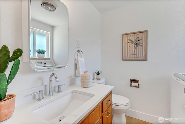 5501 N 14th St, Tacoma, WA 98406 - bathroom with toilet, vanity, and baseboards