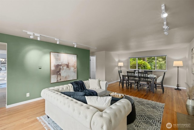 15406 NE 3rd Pl, Bellevue, WA 98007 - living room with track lighting, wood finished floors, and baseboards