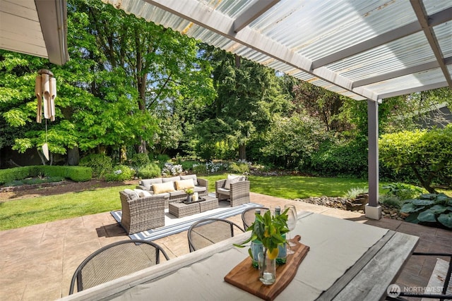 15406 NE 3rd Pl, Bellevue, WA 98007 - view of patio / terrace with an outdoor living space, a pergola, and view of wooded area